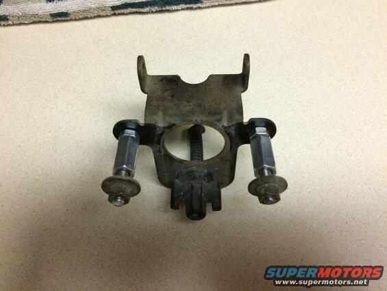 Dirty metal bracket with bolts and nuts