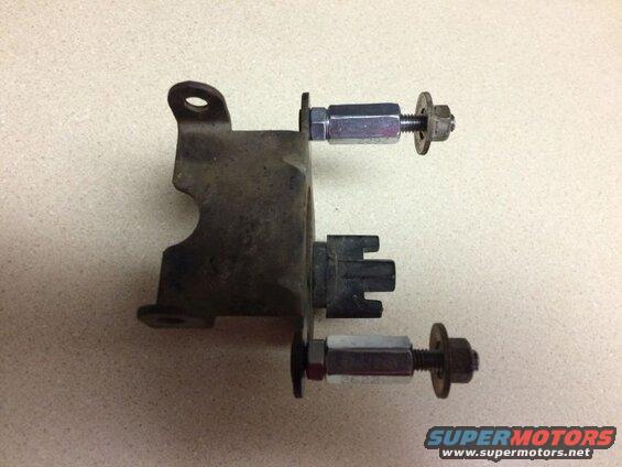 Metal bracket with bolts, nuts, and a black plastic component.