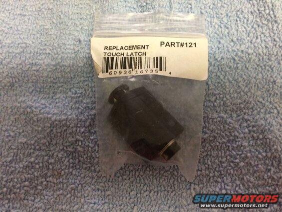 Black replacement touch latch in plastic bag with label and barcode.