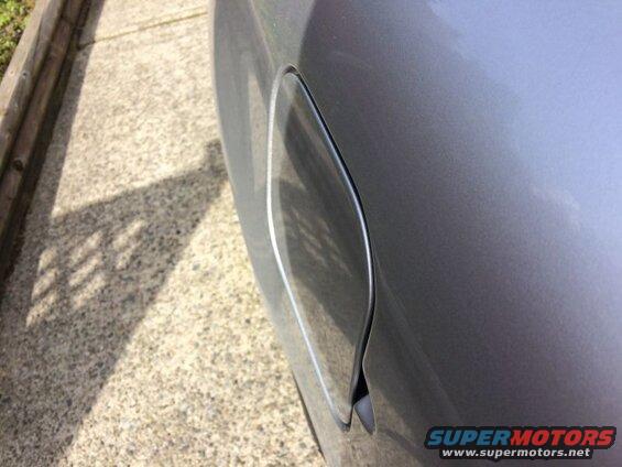 Silver Pontiac Grand Prix fuel door