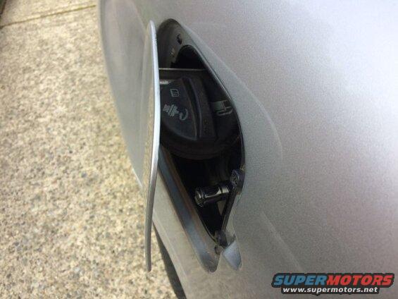 Open fuel filler door on a silver 2002 Pontiac Grand Prix