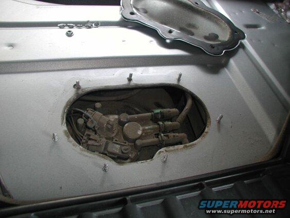 Remove the 7 10mm nuts and pry the panel off.