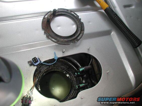Remove the lock ring; rotate counter clockwise until it clears the 4 lock tabs.