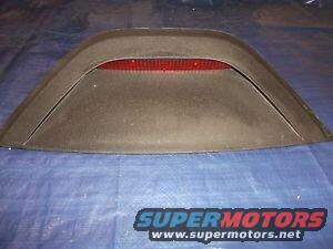 Black aftermarket rear spoiler with red reflector