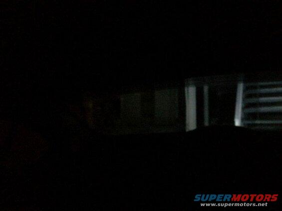 Looking out the back window from the drivers seat; reverse lights on.