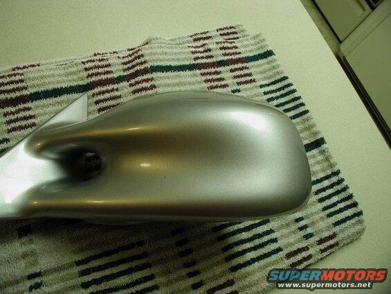 Silver car side mirror housing on a striped towel