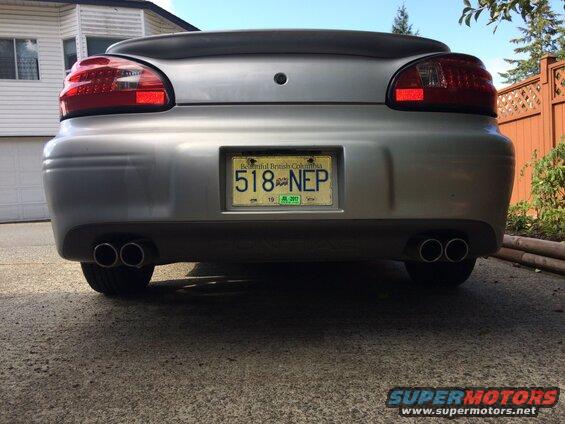 Rear view of a silver Pontiac Grand Prix with dual exhaust and BC license plate 518-NEP.