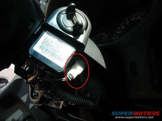 2002 Pontiac Grand Prix steering column ignition module with highlighted component.