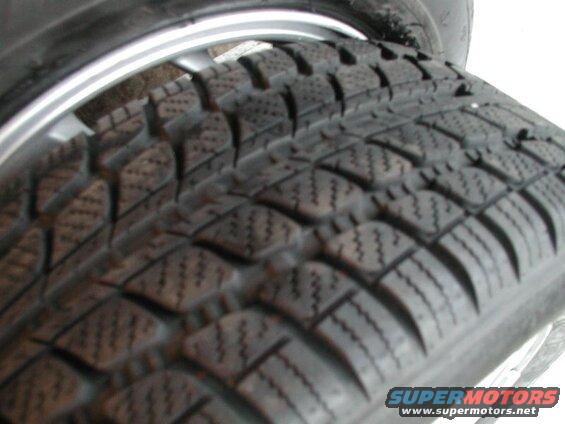 Close-up of a tire tread with silver rim