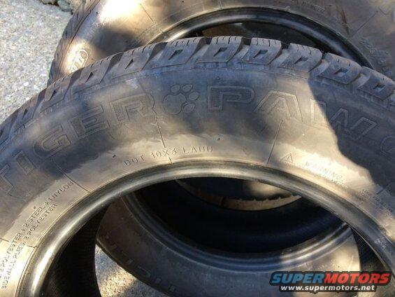 Close-up of stacked Tiger Palm tires with visible sidewall text.
