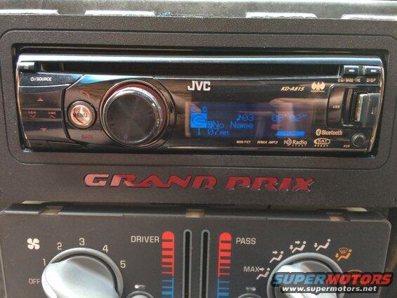 JVC KD-A815 car stereo in a 2002 Pontiac Grand Prix dashboard.