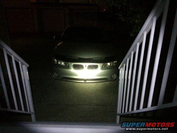 Night shot; no flash, shining flashlight at car.