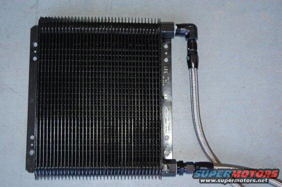Black oil cooler with braided stainless steel lines and black AN fittings.
