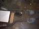 1991 Ford Crown Victoria - Two catalytic converters and exhaust pipes are laid out on a concrete floor next to a white box.