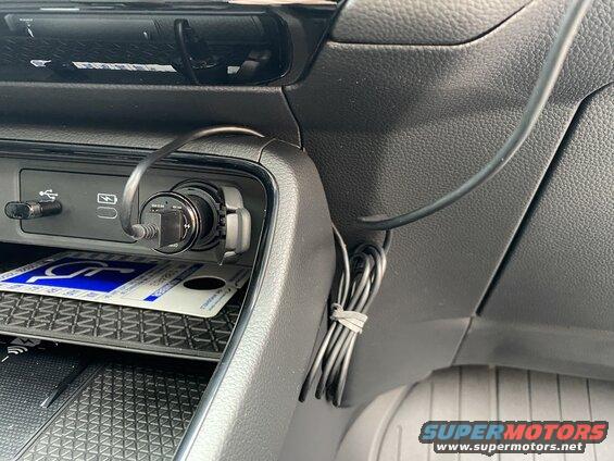 Car center console with USB charger and handicapped parking permit
