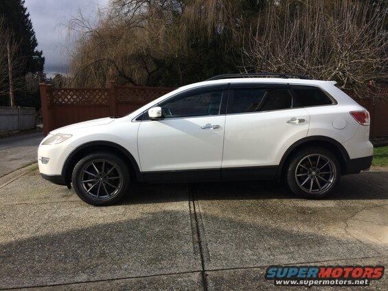 White 2009 Mazda CX-9 SUV side view with aftermarket wheels
