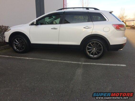 Side view of a white 2009 Mazda CX-9 with aftermarket wheels