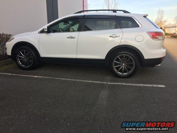 White 2009 Mazda CX-9 SUV side view with aftermarket wheels