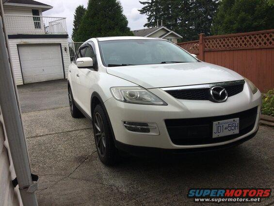 White 2009 Mazda CX-9 parked in a driveway.