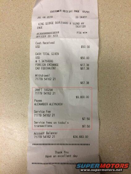 Customer receipt detailing a cash withdrawal and service fees.