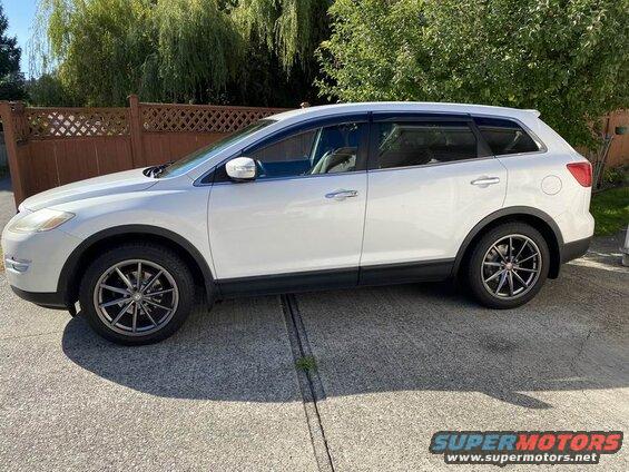 White 2009 Mazda CX-9 SUV side view with aftermarket wheels