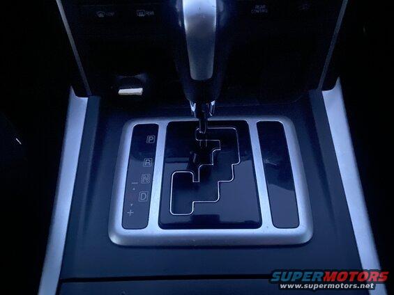 Close-up of car's automatic transmission shifter in neutral (N) position.