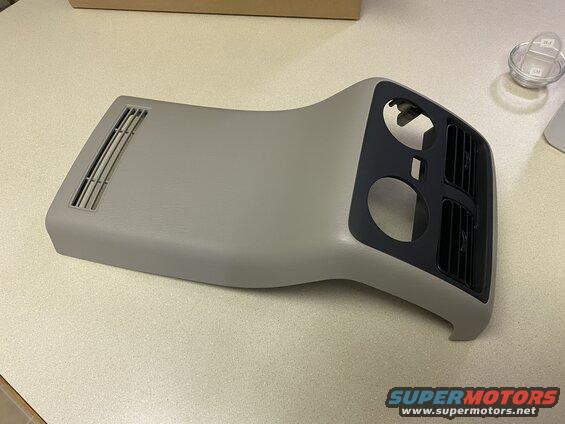 Gray dashboard trim piece with air vents from a 2009 Mazda CX-9