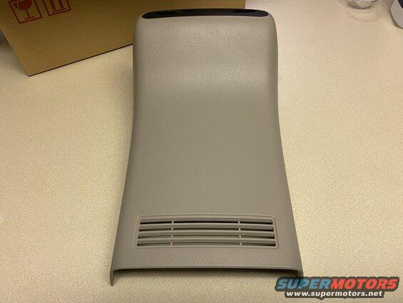 Beige plastic interior trim piece with vent