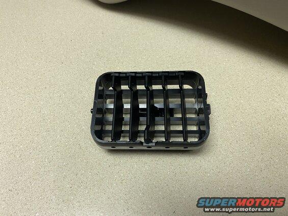 Black plastic car air vent with horizontal slats