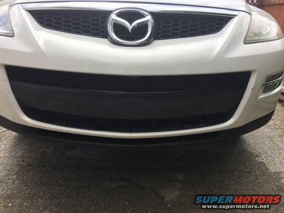 White 2009 Mazda CX-9 front grille and bumper