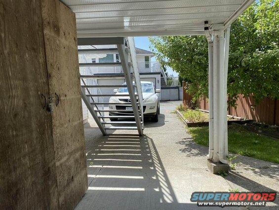 2009 Mazda CX-9 SUV parked under a covered walkway