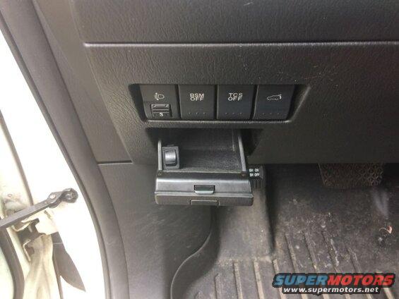 Minimal clearance in the cubby is limiting where I can have the switch, so I used some doublesided tape and stuck it in the left lower corner.