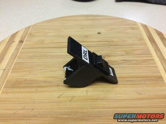 I made this plastic switch holder for the cubby, but the adhesive wouldn't hold and it ended up falling to pieces as I installed it.....