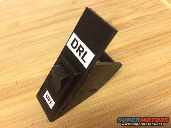 I made this plastic switch holder for the cubby, but the adhesive wouldn't hold and it ended up falling to pieces as I installed it.....