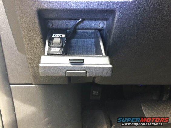 DRL switch installed in a car dashboard compartment