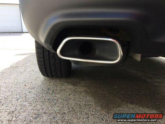 The right muffler is hanging lower than the left.