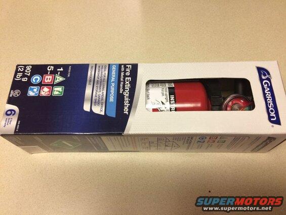 Boxed Garrison fire extinguisher with text and graphics.