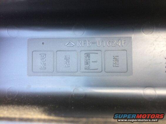 Gray plastic panel with embossed text RFB-U1624F and four buttons: (F.FOG), FAN2, S.WARM L, FAN1.