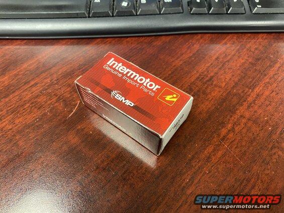 Box of Intermotor Genuine Import Parts on a wooden desk