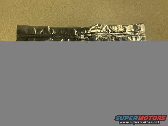 Close-up of a metallic silver resealable bag top edge.