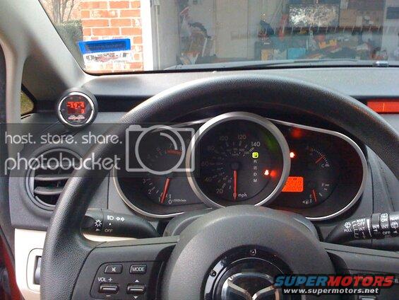 Interior of a Mazda CX-9 dashboard with a digital gauge showing -19.4.