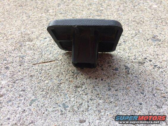 Black plastic part with textured surface on concrete