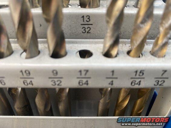 Drill bits in a holder with fractional measurements