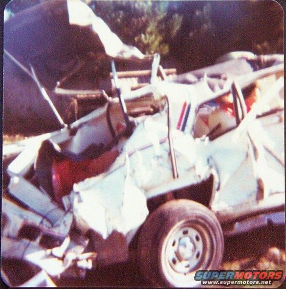 1974 Chevrolet Nova, heavily damaged, 3q-front view, white exterior with red and blue stripes