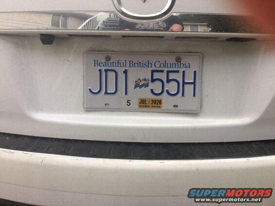 White SUV rear license plate JD1 55H, Beautiful British Columbia, JUL 2020 sticker