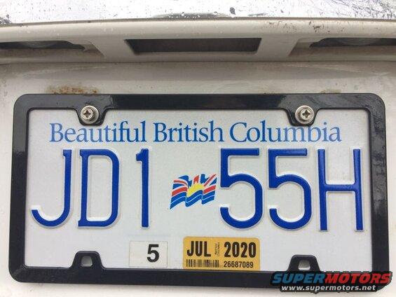 British Columbia license plate JD1 55H with JUL 2020 sticker on a white vehicle.