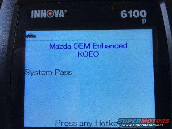 Innova 6100p scanner screen showing 'Mazda OEM Enhanced KOEO System Pass' and 'Press any Hotkey'