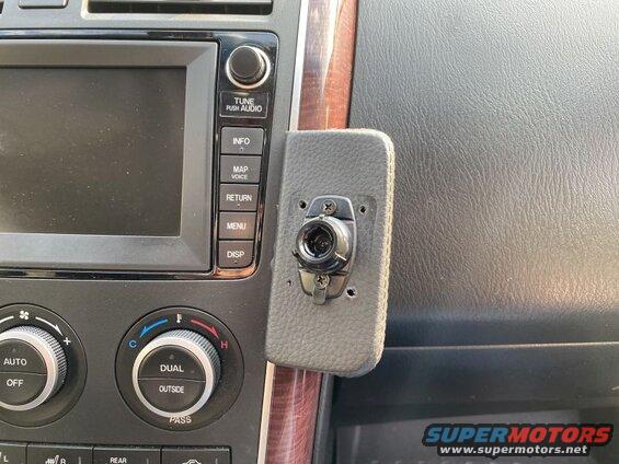 Custom mount with camera attached to a car dashboard.