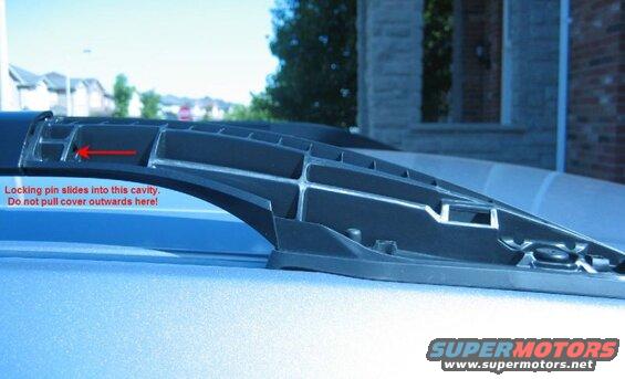 Found this online; shows the tab that holds the roof rail cover in place.