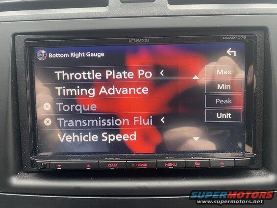 Car infotainment screen showing gauge settings with options like Throttle Plate, Torque, and Vehicle Speed.